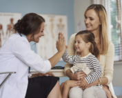 child and mother visiting a doctor